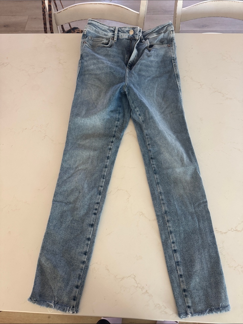 Light Wash Women’s Skinny Jeans with distressed bottom
